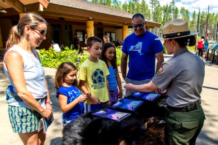 Receiving the Junior Ranger badge photo