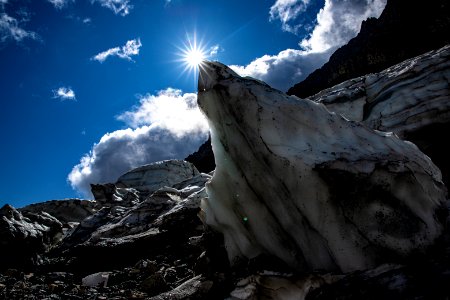 Blocks of fallen ice from Sexton Glacier block the sun. photo