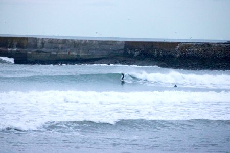 Surfers on Aberdeen Harbour in the Evening photo