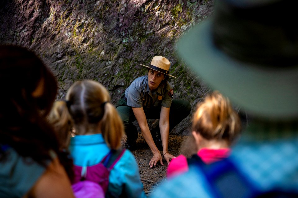 A park ranger enjoying a hike to Avalanche Lake.