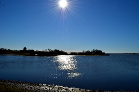 Sunshine reflects on Trustom Pond (RI) photo