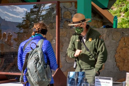 Ranger Helping Visitors at Logan Pass Visitor Center photo