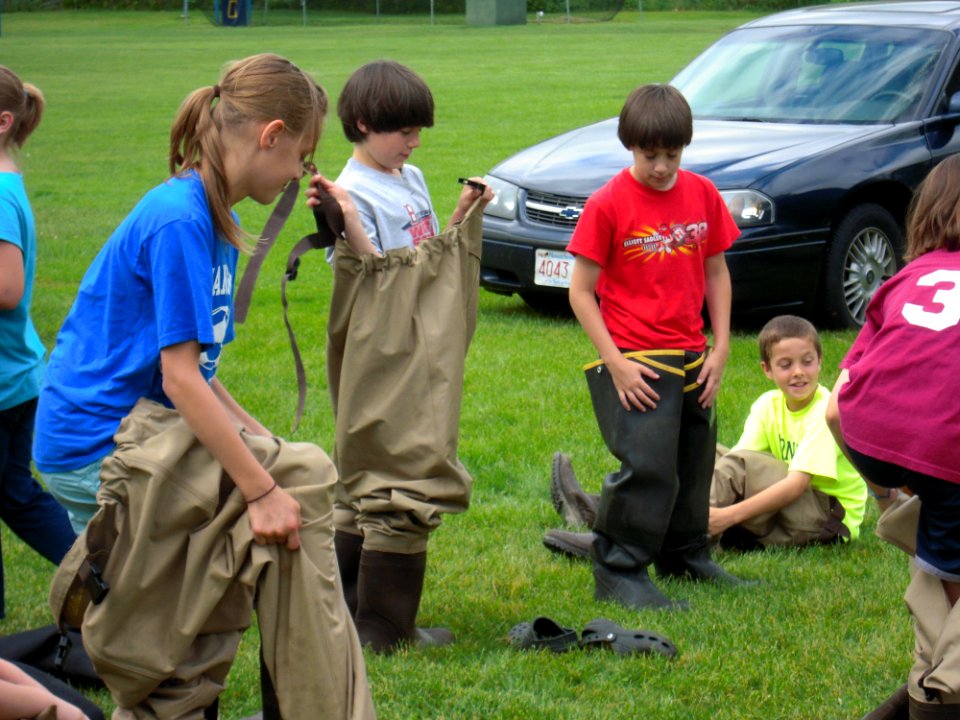 Putting on waders
