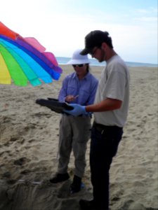 CDIP Summer Employee assists with collecting data. photo