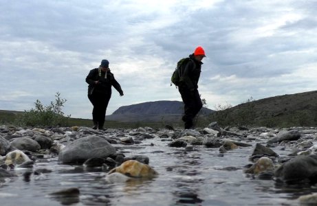 Cait and Julia hop over the stream