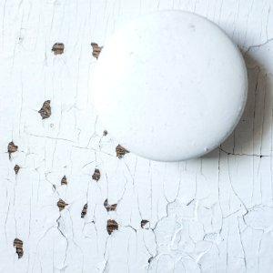 The worn dresser - peeling paint on wood photo