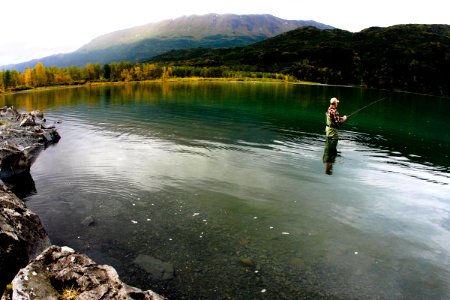 Visitor fishing in Uganik Lake