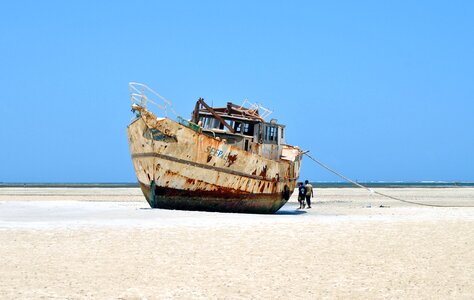 Boat abandoned beach photo