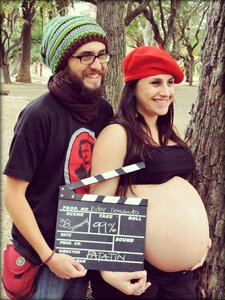 Couple baby on board maternity photo