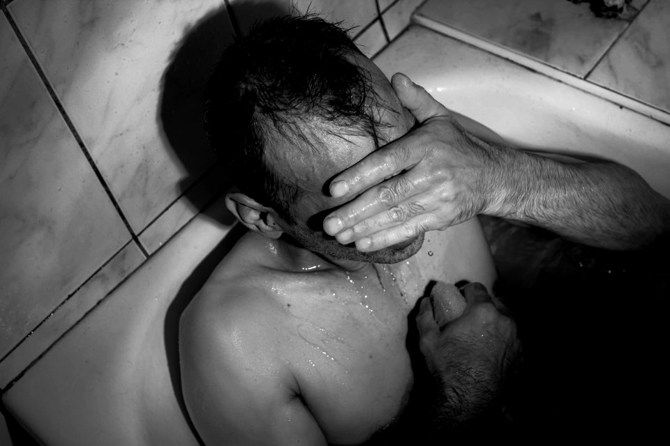 Man taking a bath.