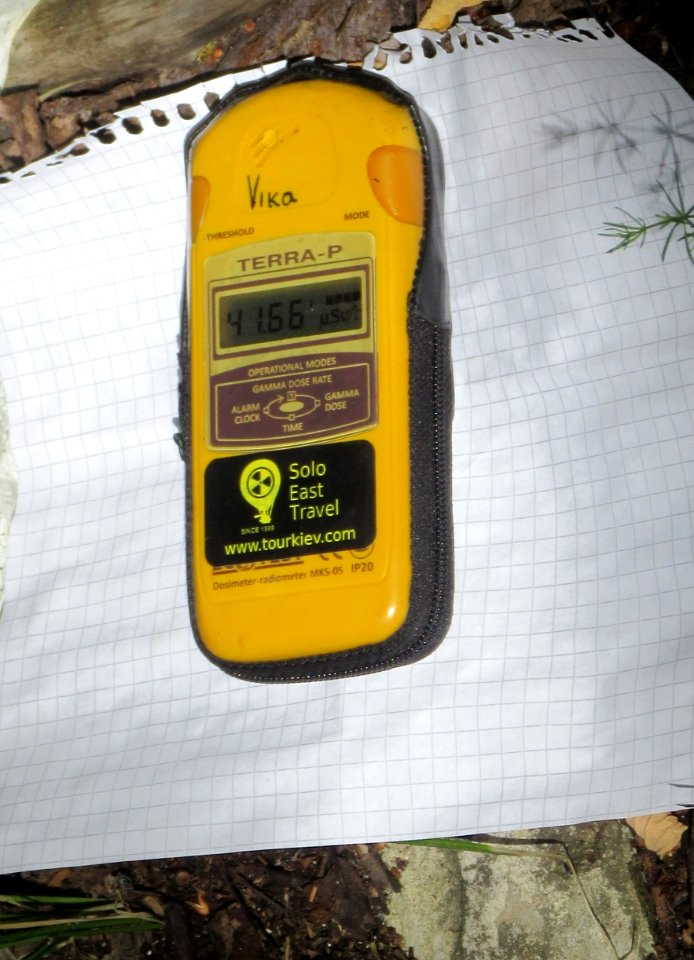 Geiger counter pretty high on a hotspot by the river Pripyat Chernobyl exclusion zone Ukraine