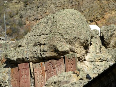 Satellite dishes hidden behind the khachkars Geghard Monastery Armenia