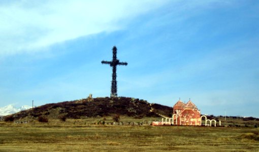 Cross seen from four directions and church Armenia