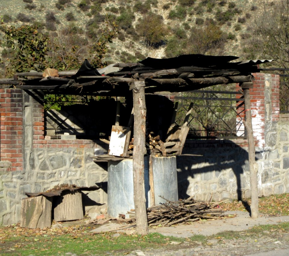 Tendir where refugees make bread on the side of the road Sheki Azerbaijan