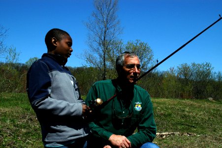 Regional Director Tom Melius Chats with Student About Fishing Experiences