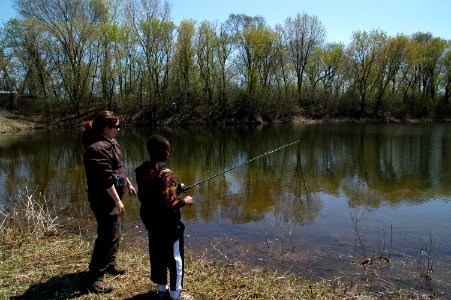 Kid Fishes with Help from Laura Bonneau, Visitor Services Manager at Minnesota Valley photo