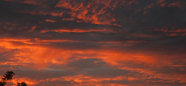 Blazing sky clouds red orange sky