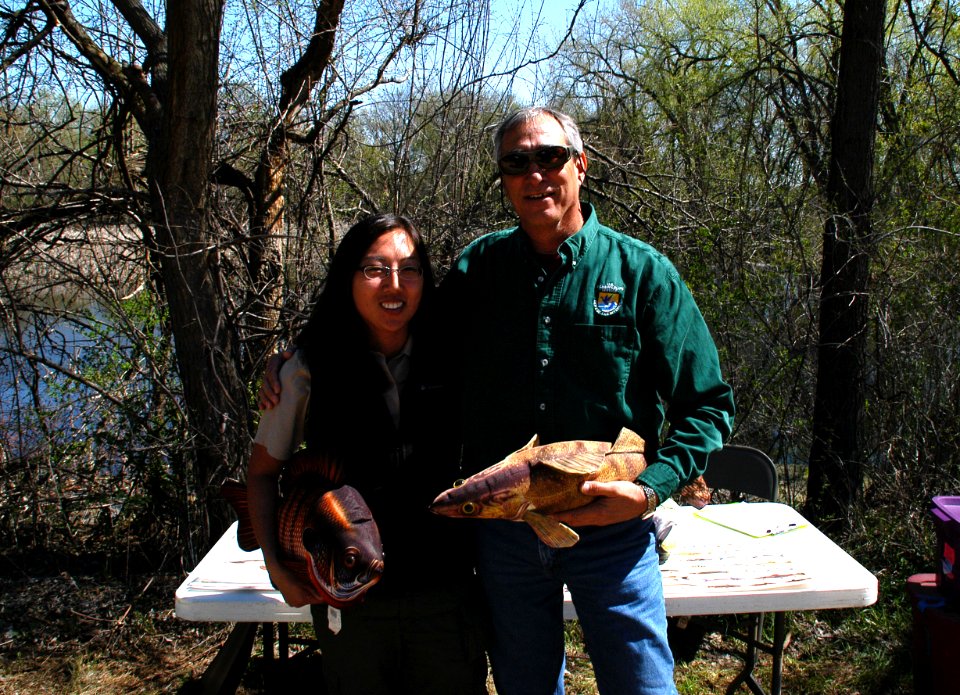 Regional Director Tom Melius and MN DNR Krista Jensen show off the Fish Identification Tools