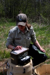 Janet McConnell checking samples of the river's pH to determine the level of lampricide to use in this treatment. photo