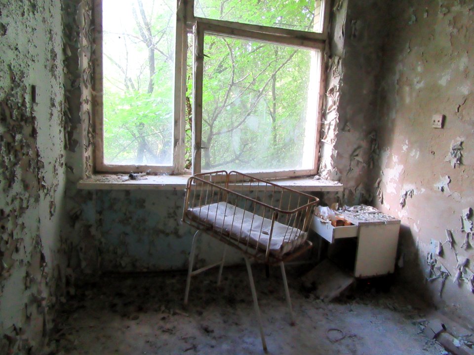 Crib by window in maternity ward Pripyat Hospital Chernobyl exclusion zone Ukraine
