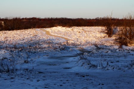 A trail leads through the snowy tallgrass prairie at Big Muddy National Fish and Wildlife Refuge in Missouri