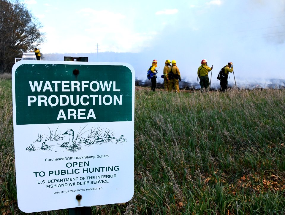Crews perform a controlled burn at Schlee Waterfowl Production Area