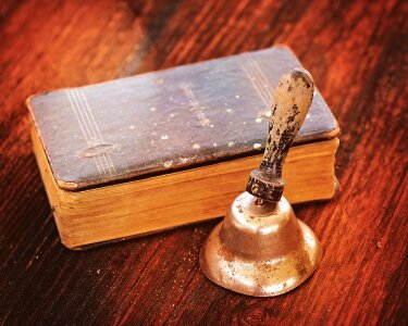 Prayer book bell wood photo