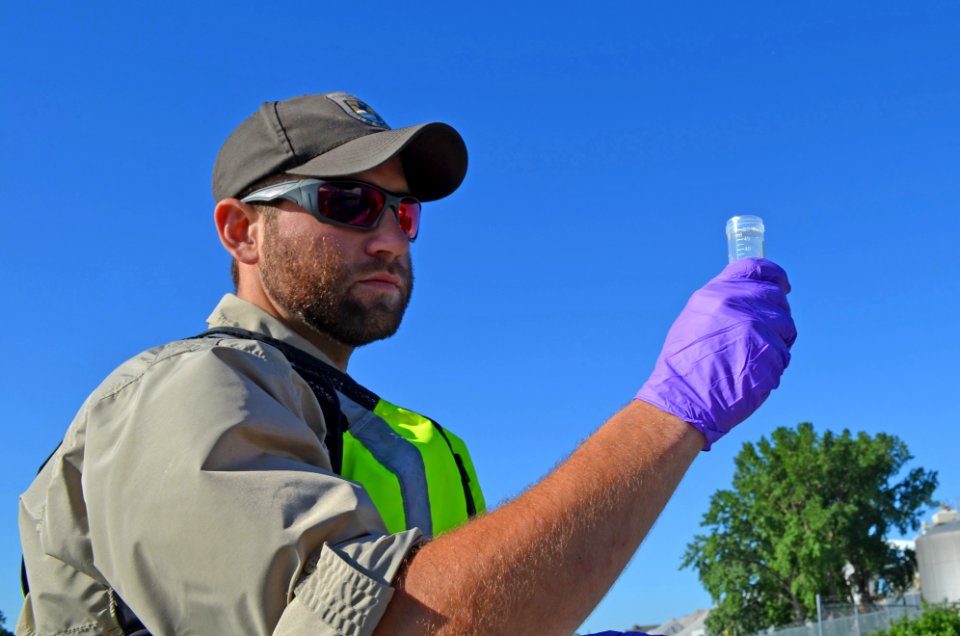 Collecting eDNA water samples on the Fox River