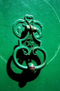 Door knocker green door