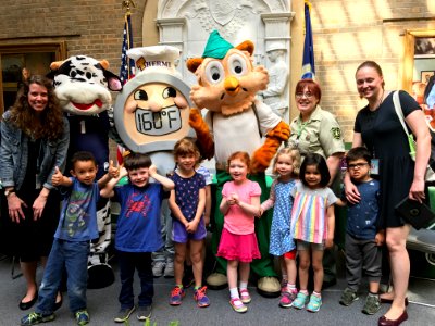 School children meet Milkshake, Thermy and Woodsy Owl.