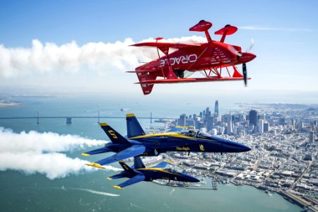 In advance of Fleet Week performances, 'Team Oracle' aerobatics pilot Sean D. Tucker and U.S. Navy 'Blue Angels' fly over the San Francisco Bay during a photo flight on Thursday, Oct. 5, 2017