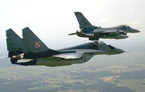 General Dynamics F-16C Fighting Falcon from the 183d Fighter Wing, Illinois ANG, flies in formation with a Polish Mikoyan-Gurevich MiG-29A.