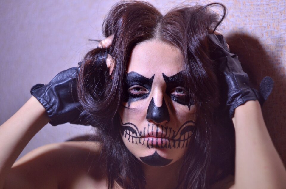 Brunette drawing on the face makeup