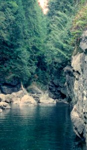 River water with cliffs and trees photo