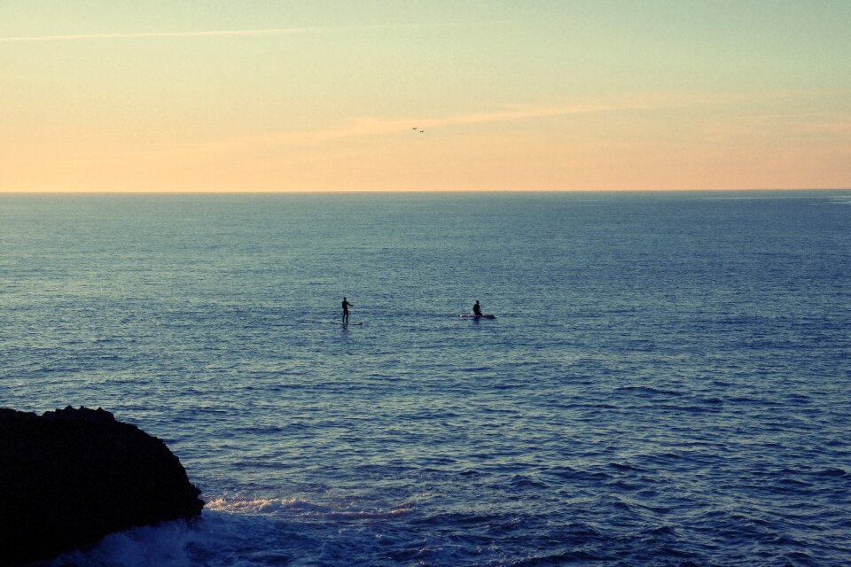 Paddle boarding paddle boarders sunset