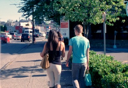 Couple walking on sidewalk photo