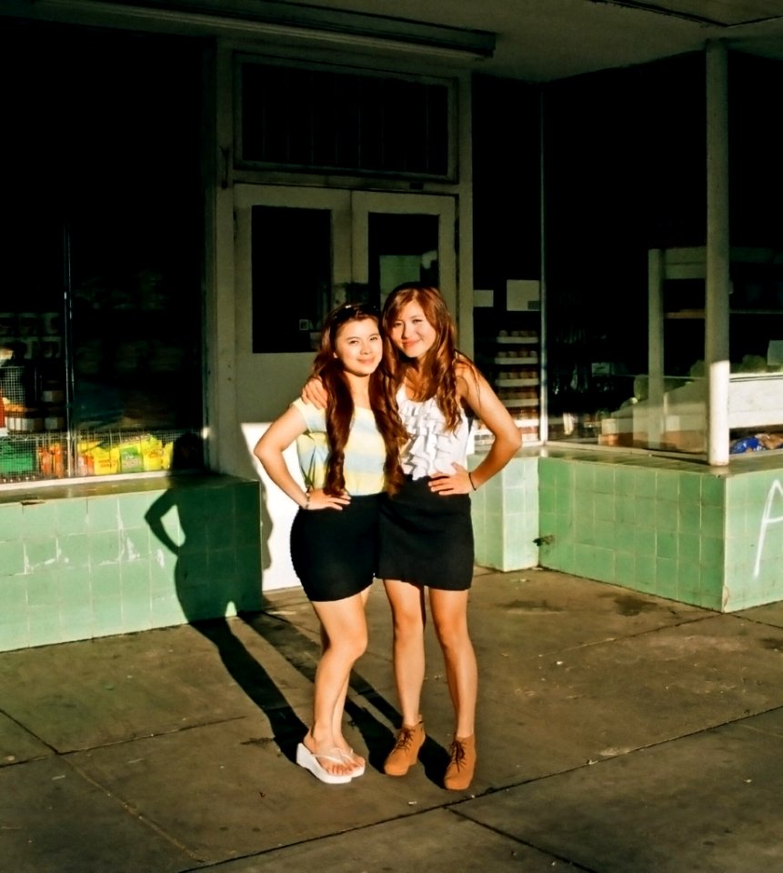 sisters infront of closed market