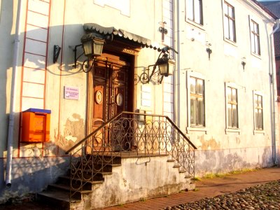 Graceful old building with orange mailbox in Pärnu, Estonia