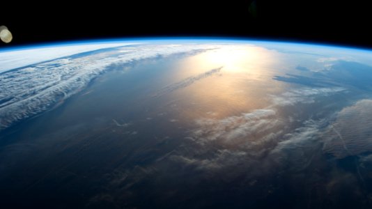 ISS049e028944 (10/05/2016) ---The sun rises slowly spreading a golden glow over the Earth as the International Space Stations speeds by on orbit. The crew of  Expedition 49 captured this  image.