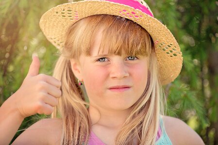 Girl hat thumbs up photo