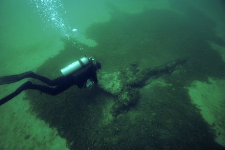 TBNMS diver investigates underwater wreck photo
