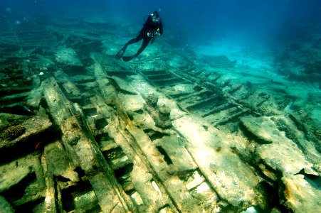 PMNM diver over shipwreck photo
