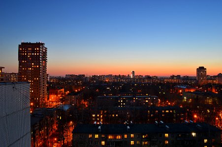 Magicness and warm springtime evening in Korolev-city after sundown on the roof photo