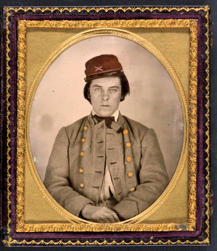 Unidentified artillery soldier in Confederate uniform and kepi hat.