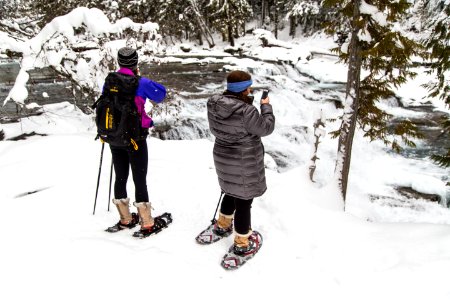Snowshoers taking Photos at McDonald Creek Falls photo