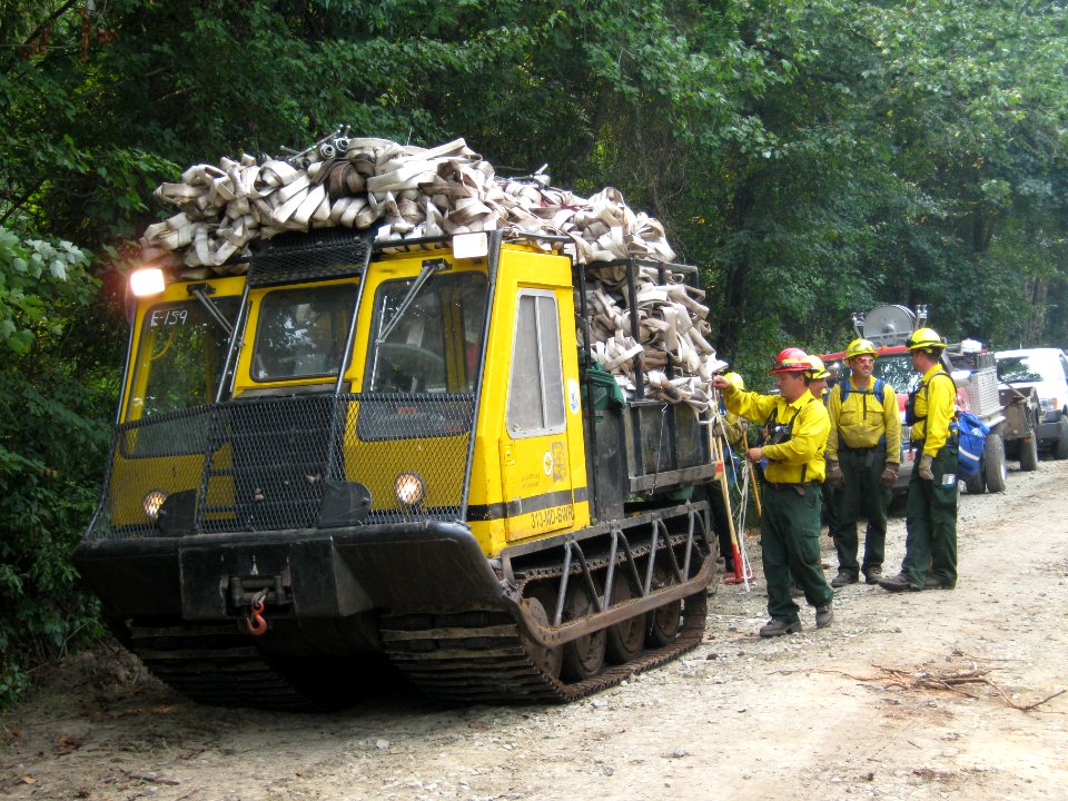 Bombardier laden with hose