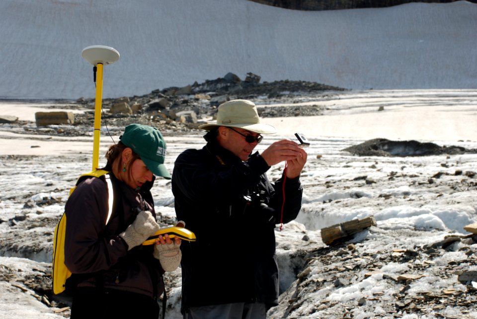 Scientists measuring the terminus of Grinnell Glacier photo