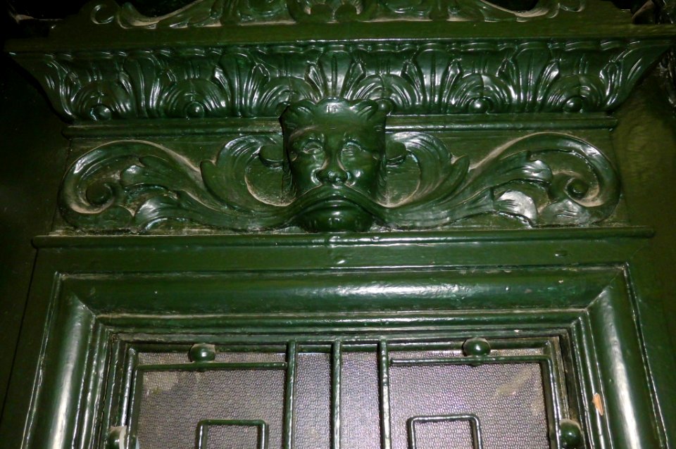 grotesque on wooden door