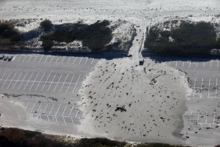 Beach overwash onto parking lot (RI) photo