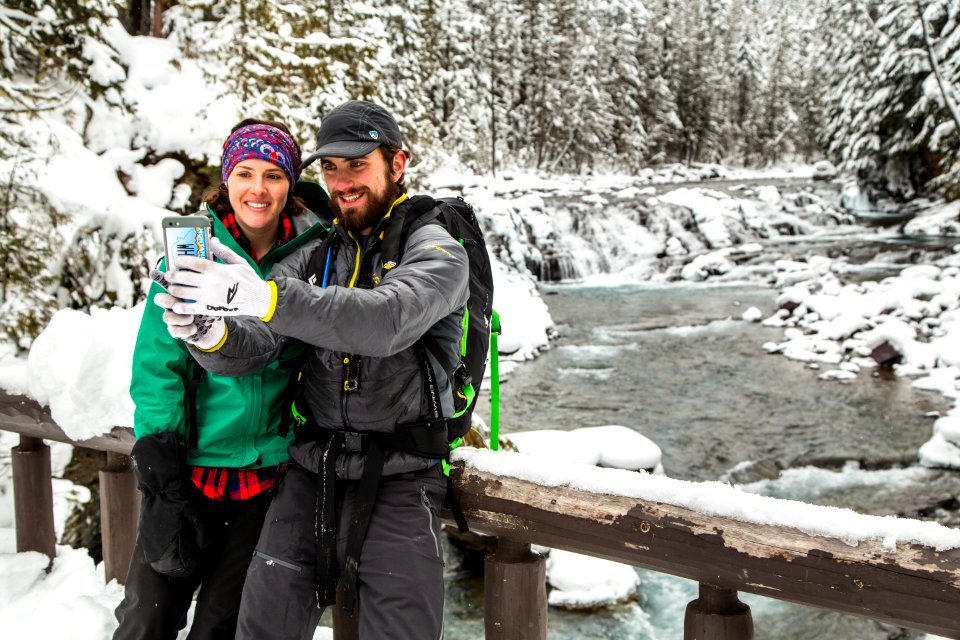 Winter Visitors Taking a photo at Sacred Dancing Cascades